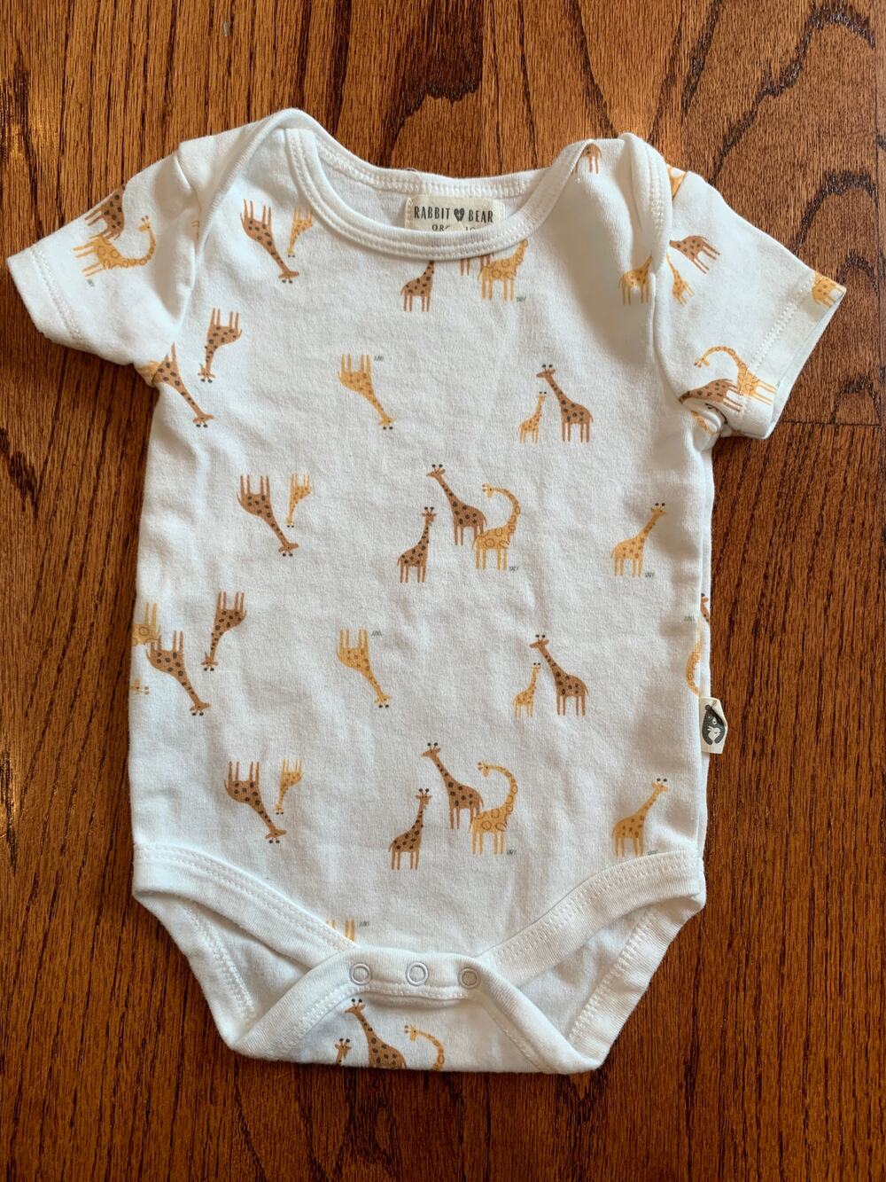 Rabbit + Bear Organics Allover Giraffe Print Onesie | White Orange | 6-9 months